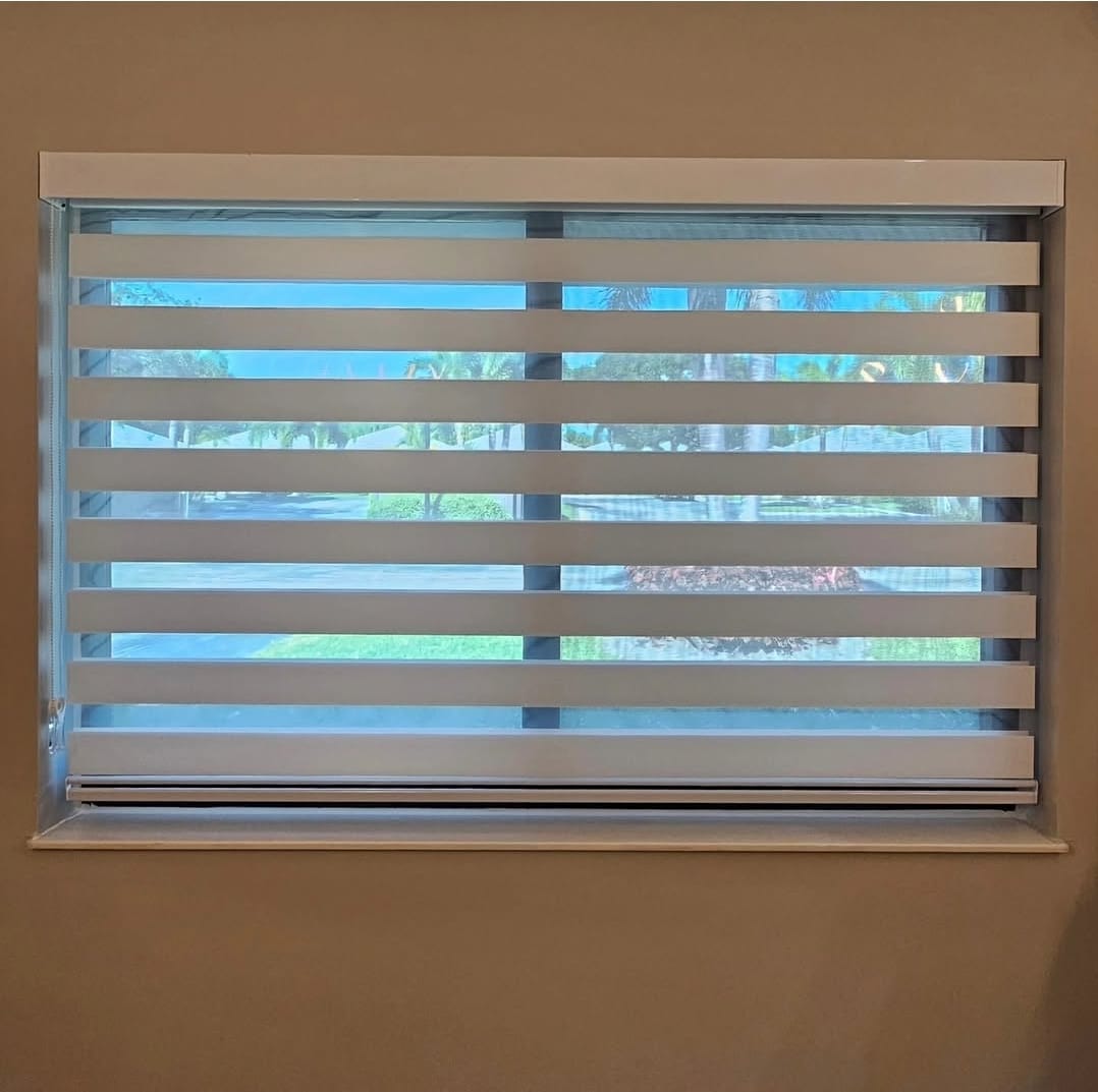 White zebra blind in a recessed window overlooking a street