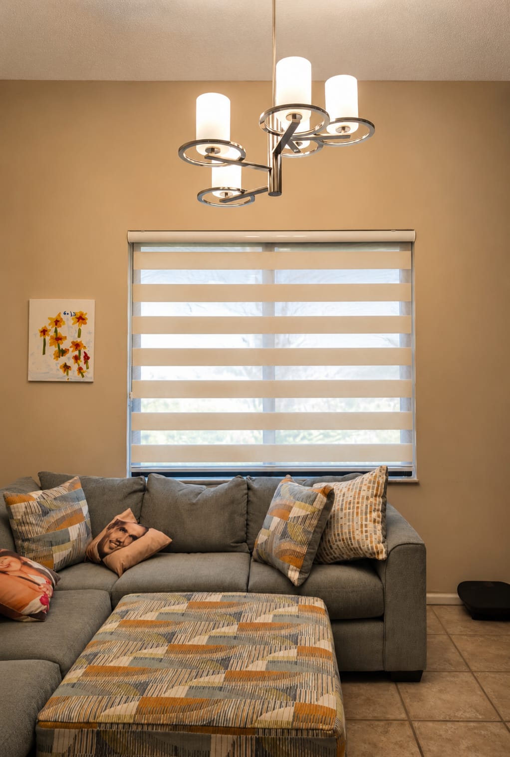 White zebra blind above a living-room sofa